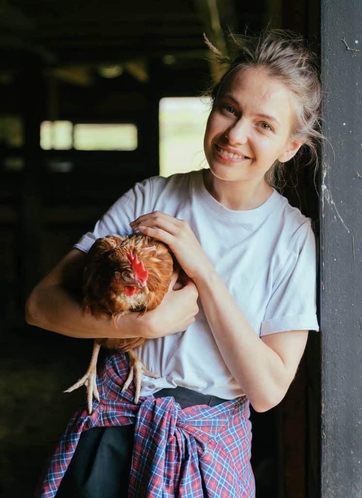girl holdig chickens